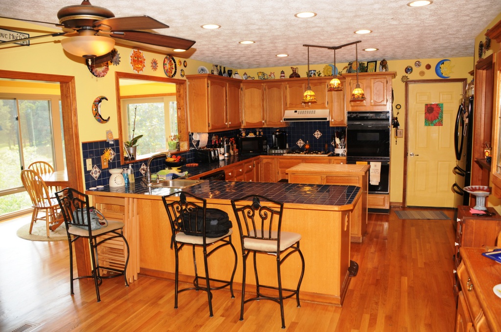 Kitchen view with wood flooring